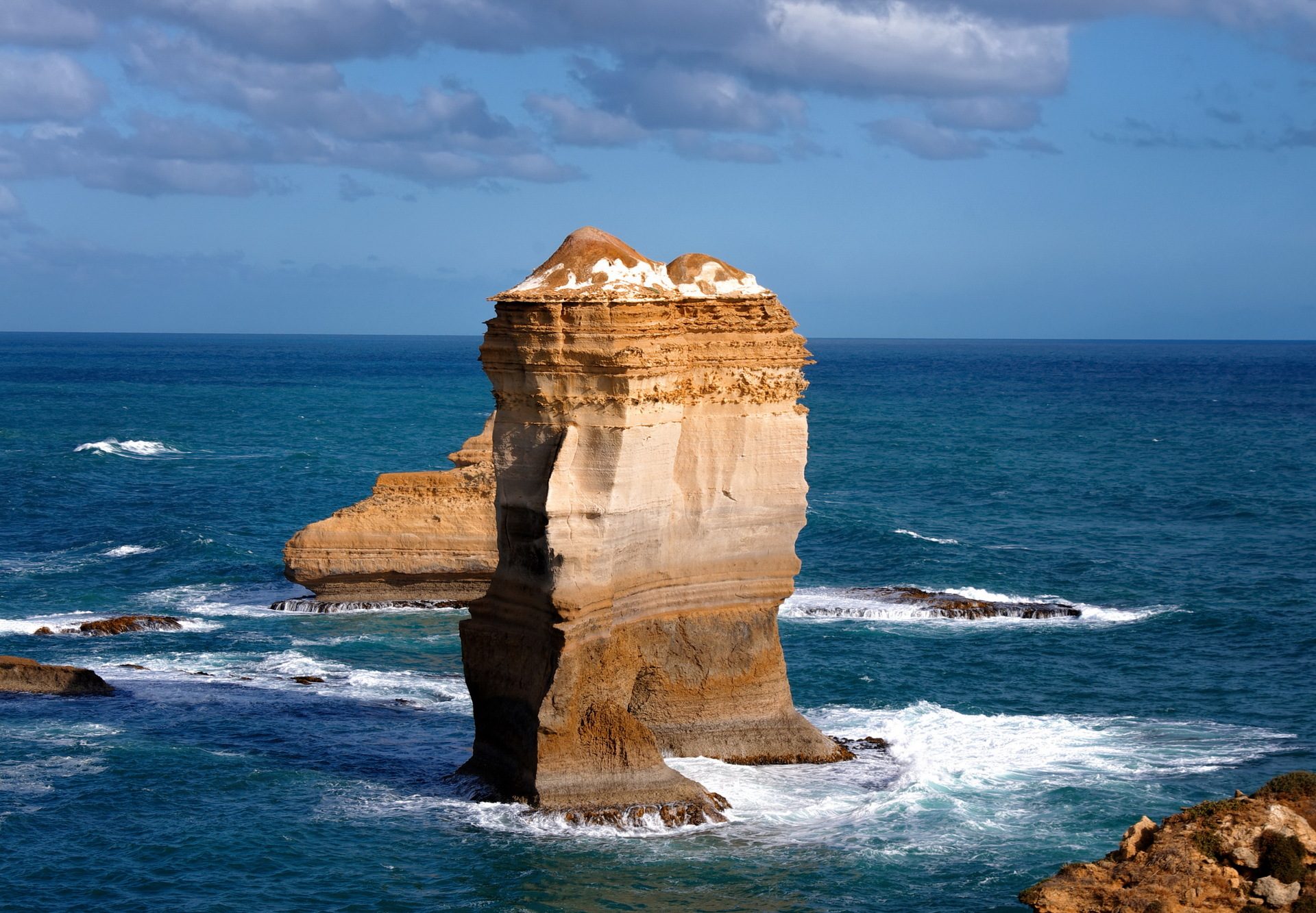 Limestone sea stacks of the Twelve Apostles rising from the surf along the Great Ocean Road