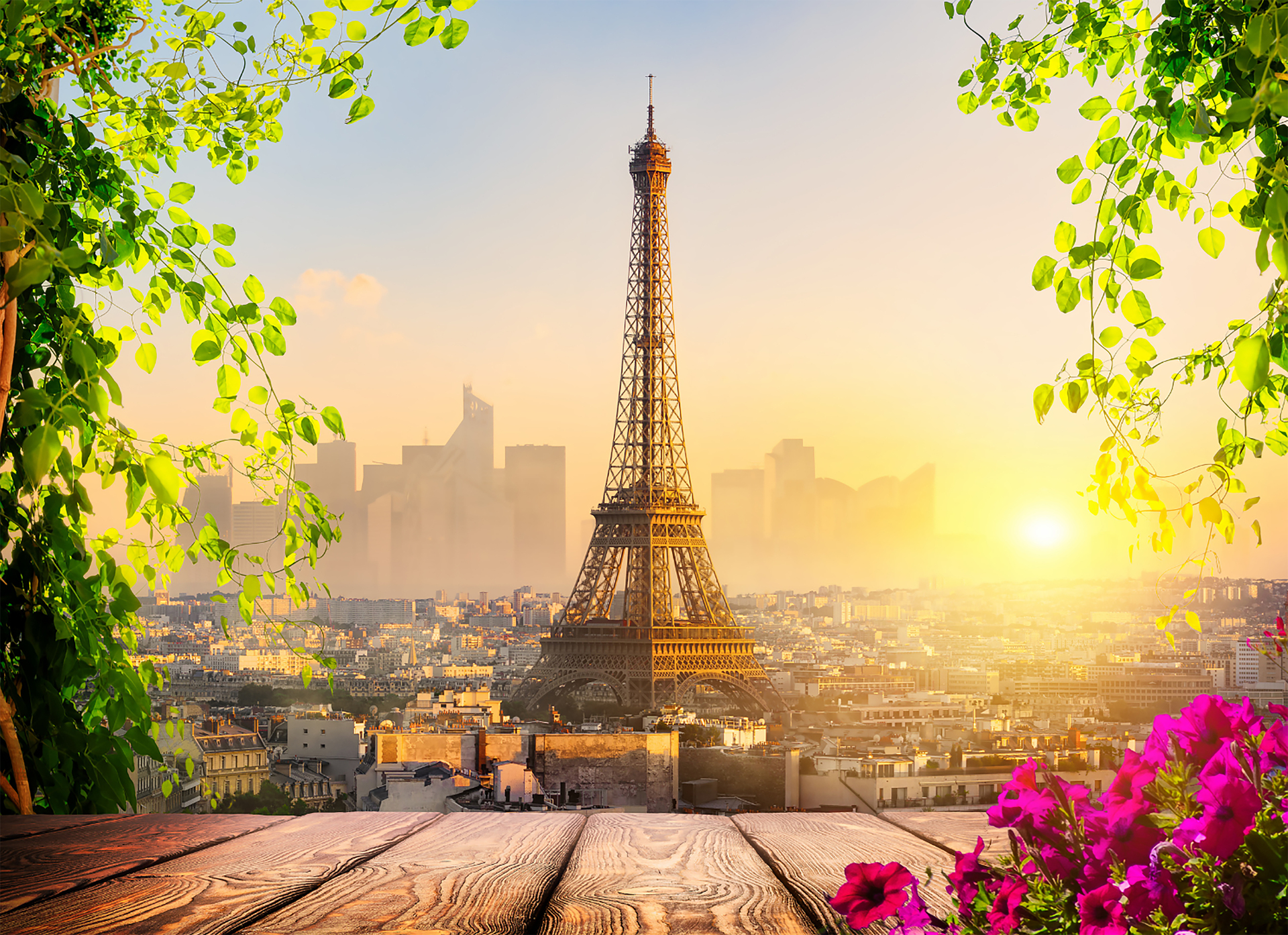 The Eiffel Tower glowing at sunrise over Paris