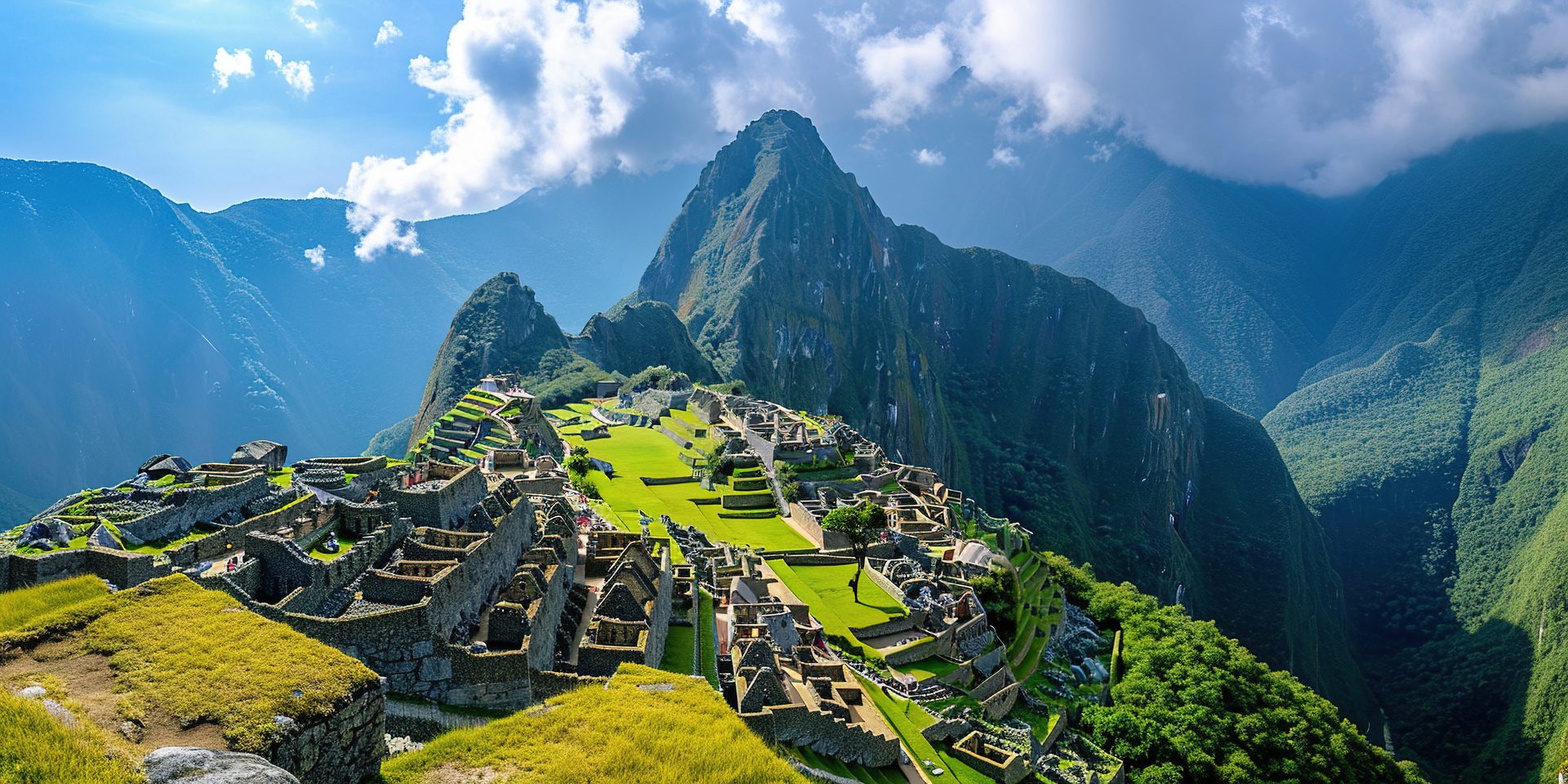 The ruins of Machu Picchu among the green peaks of the Andes